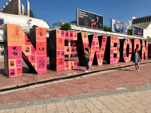 A photo of a large outdoor installation that spells out "Newborn" in red and orange letters.
